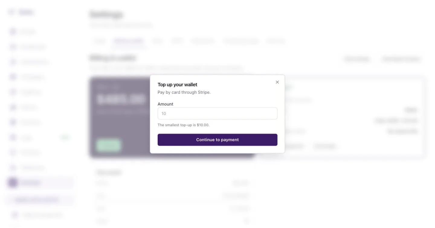 The Top up your wallet dialog with quick amounts and a custom amount